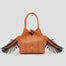 Bolso bandolera de piel vegana de máxima calidad modelo ELISA naranja. Asa bandolera con flecos estilo folk, cortes y pespuntes en contraste